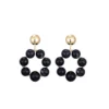 Statement oorstekers rond, oorbellen, rond kunststof in zwart, gouden metaal hanger, 68 bij 44mm,